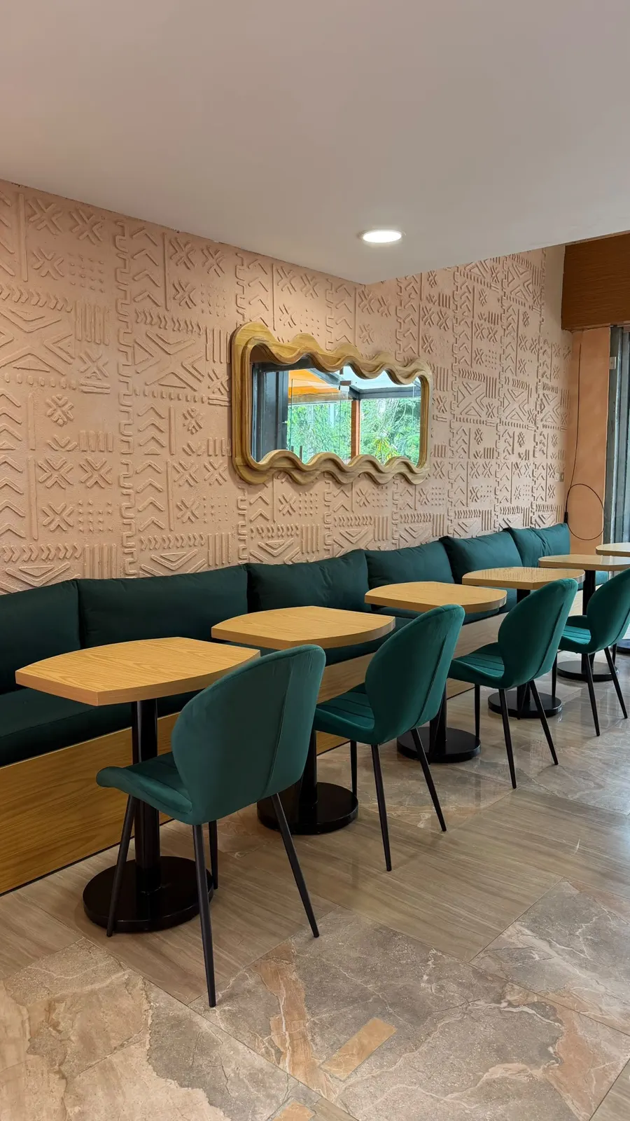 Healthy & Co dining room with green banquettes